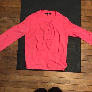 Pink wrap top with button clasp at neck